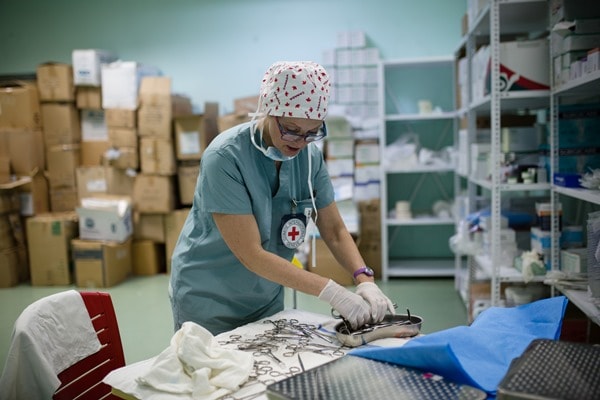 OT nurse Dianne Hyra-Kuzenko prepares surgical equipment for sterilization