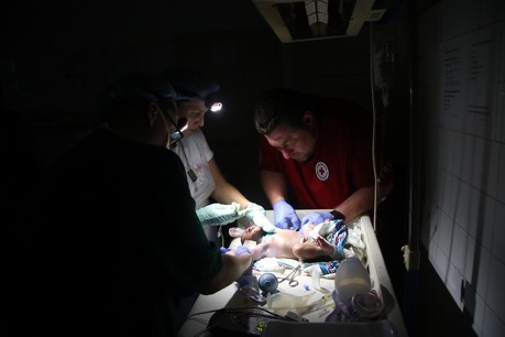 A power outage means medical care needed to be delivered in the dark in Mozambique