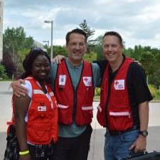 three Red Cross volunteers smiling