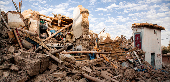 The aftermath of the 2023 Moroccan earthquake - debris and a building destroyed.