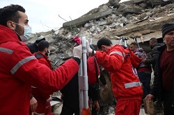 Red Crescent workers ready to help people that were found in the rubble