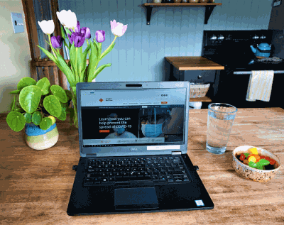 A laptop on a kitchen table as a workspace